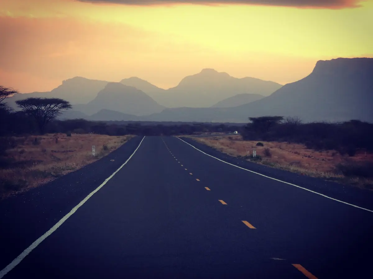 Isiolo to Marsabit highway running toward mountains at dusk